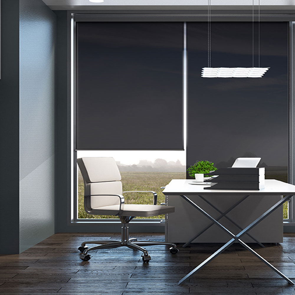 Blackout roller blinds in a commercial office fitted by Shadesmen