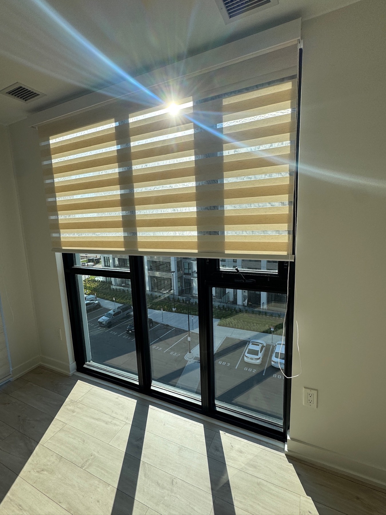 Zebra shades fitted to a patio door in a condominium unit